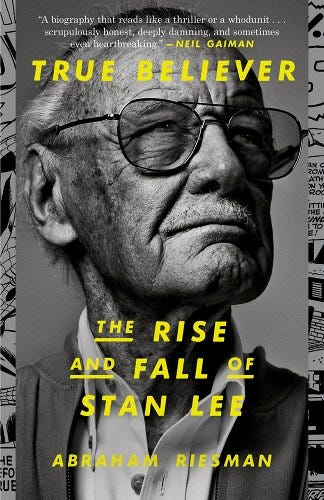 A book cover featuring a photo of an older Stan Lee wearing his large tinted glasses. The photo is grayscale and the text is in bright yellow. The text reads: True Believer: The Rise and Fall of Stan Lee. Abraham Riesman.
