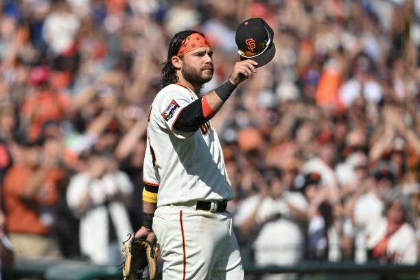 Brandon Crawford of the San Francisco Giants acknowledges the crowd after he was taken off the field during the ninth inning at Oracle Park on...