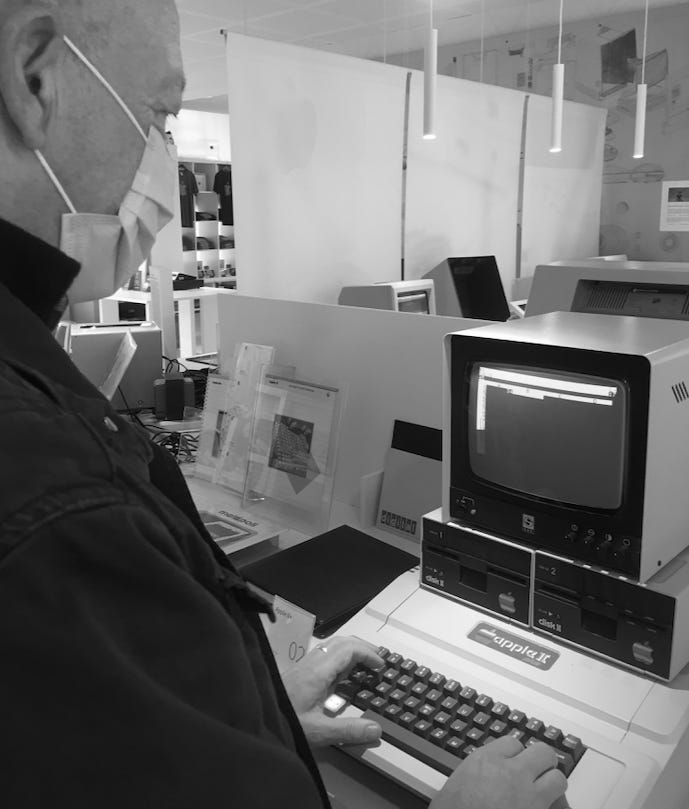 A picture of the author using an Apple II computer