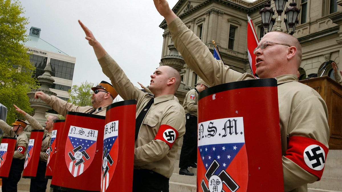 Line of brown shirt Michigan Nazis saluting in a public demonstration.