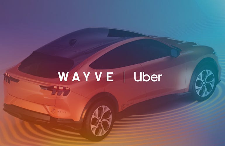 An image of an orange Wayve vehicle with the Wayve and Uber logos overlayed on top. 