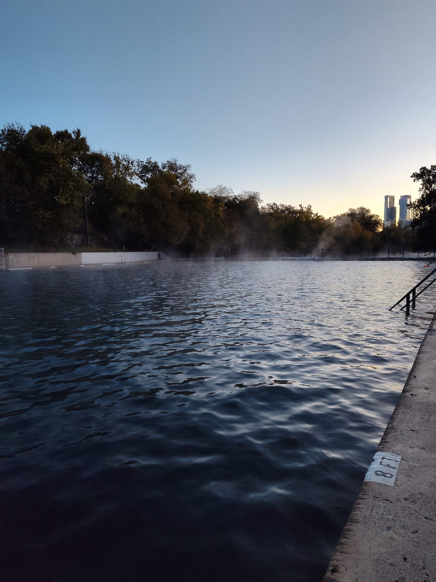 Barton Springs Pool at 7AM, columns of mist standing on the water. Pained on the deck in the foregroudL 8 FT.