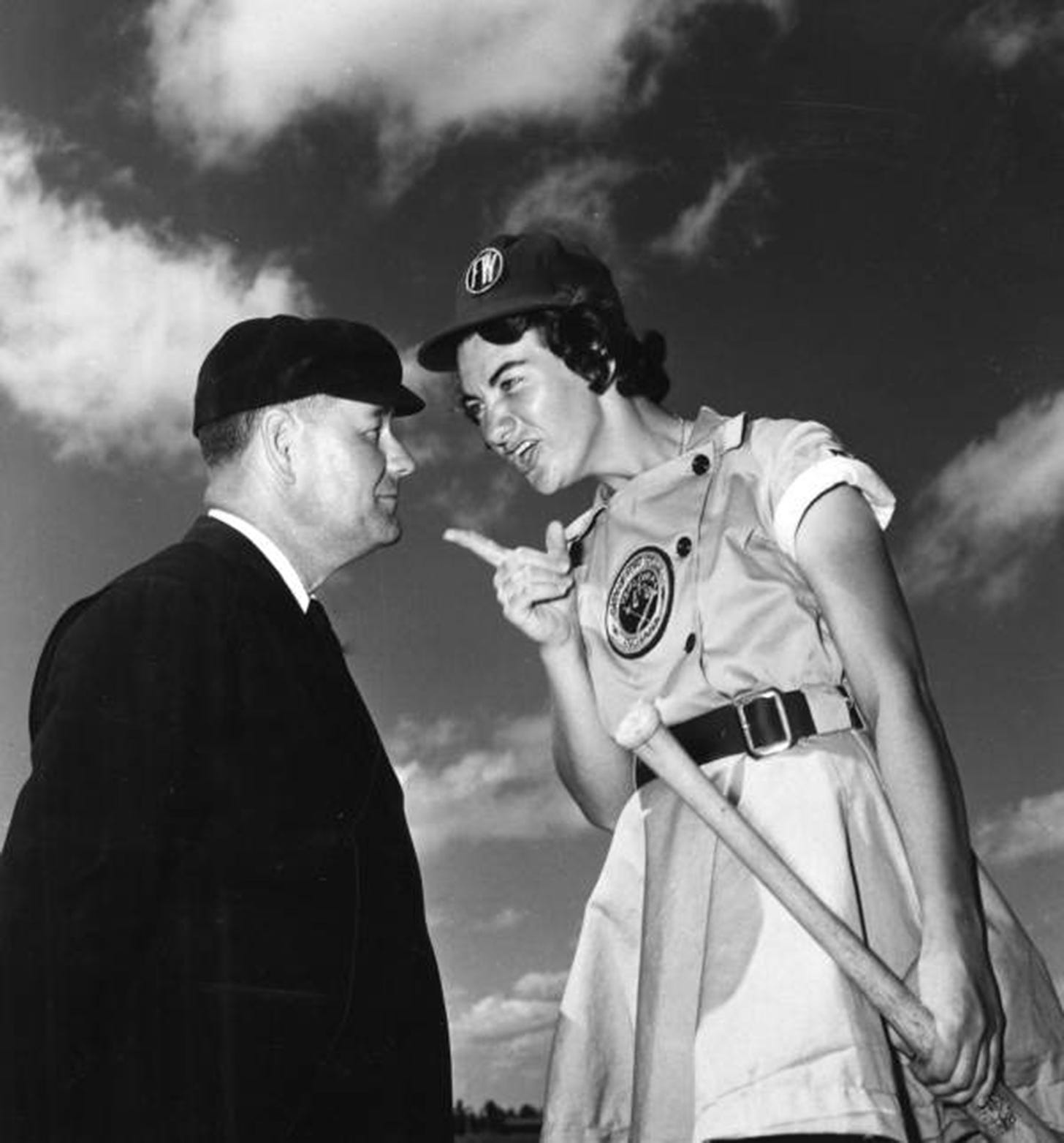 Fort Wayne Daisies player Marie Wegman arguing with umpire Norris Ward, 1948. (Photo courtesy State Archives of Florida)