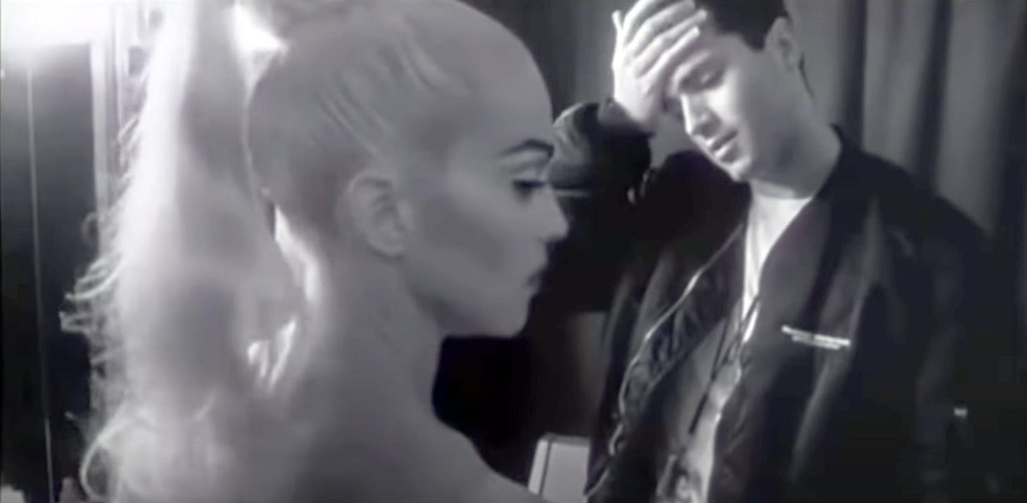 Madonna and brother Christopher chat near a mirror on Truth or Dare