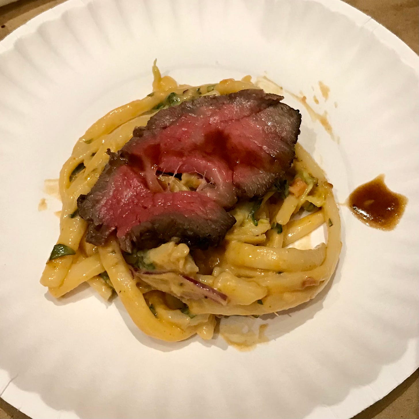 medium rare slice of grilled wagyu tri tip steak with Thai peanut noddle salad 