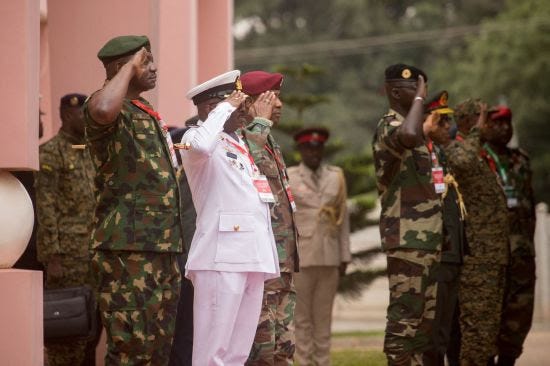 Ghana’s top defense official welcomes the Ivory Coast’s top defense official at an ECOWAS meeting in Ghana.