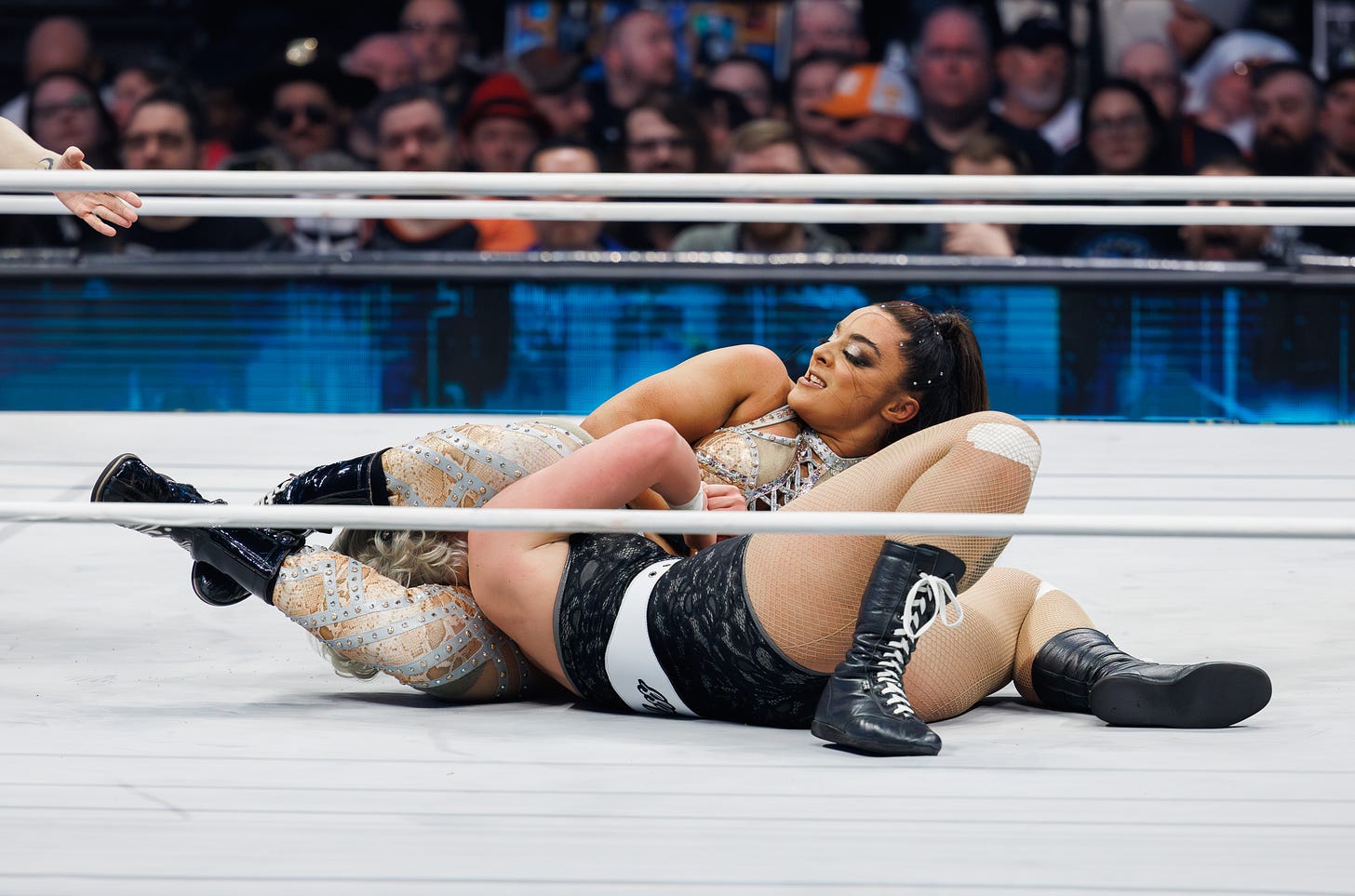 Deonna Purrazzo applies a headscissors hold to Toni Storm during their match at AEW Revolution 2024