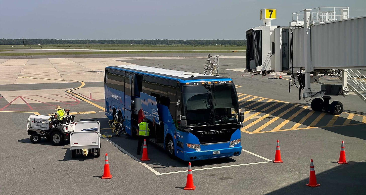 Bus parked at airport gate.