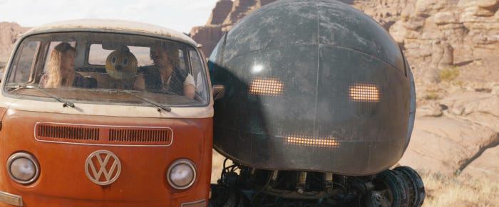 Millie Bobby Brown, Chris Pratt and two animated robot characters In a still from &lsquo;The Electric State.&rsquo; 