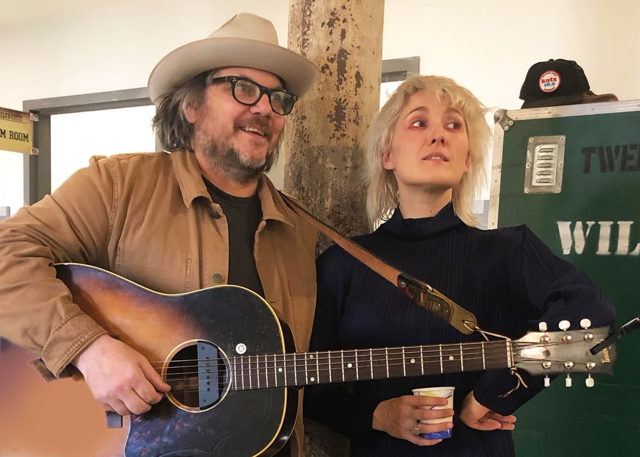 Jeff and Cate Le Bon at Solid Sound Festival. Jeff holds a guitar, they both look off camera to their left.