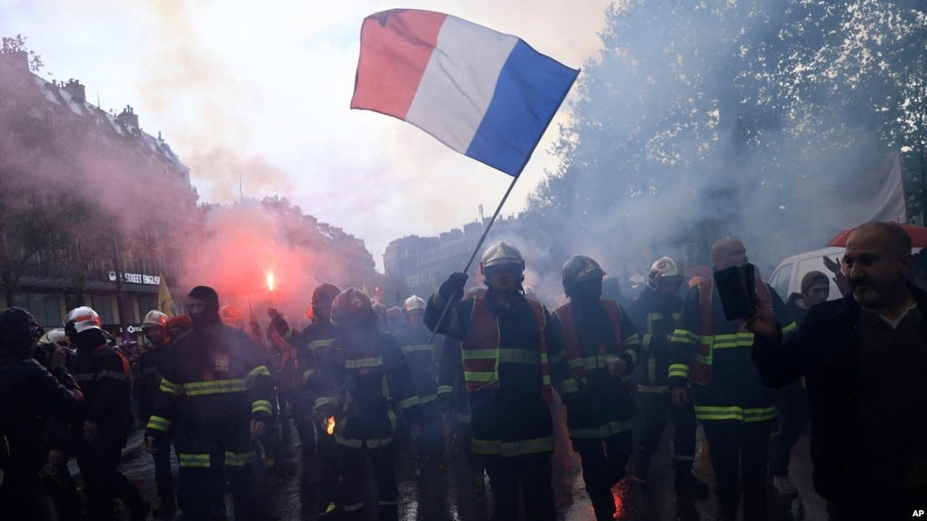 Rescue workers march during a demonstration, May 1, 2023 in Paris. Annual May Day celebrations were also massive protests against President Emmanuel Macron's recent move to raise the retirement age from 62 to 64.