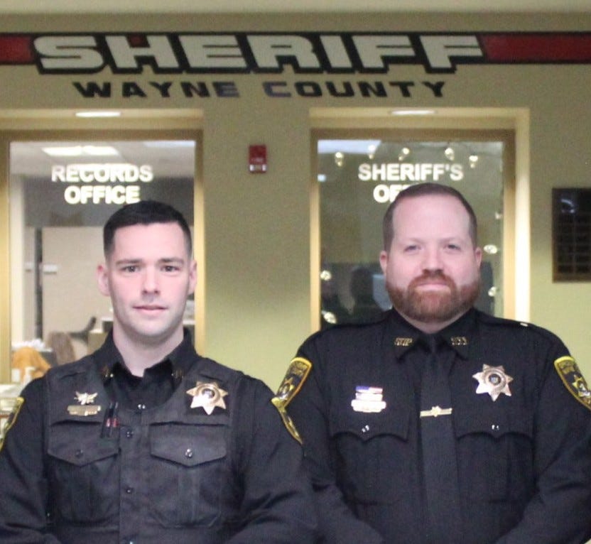 May be an image of 2 people and text that says 'SHERIFF RECORDS OFFICE SHERIFF'S'