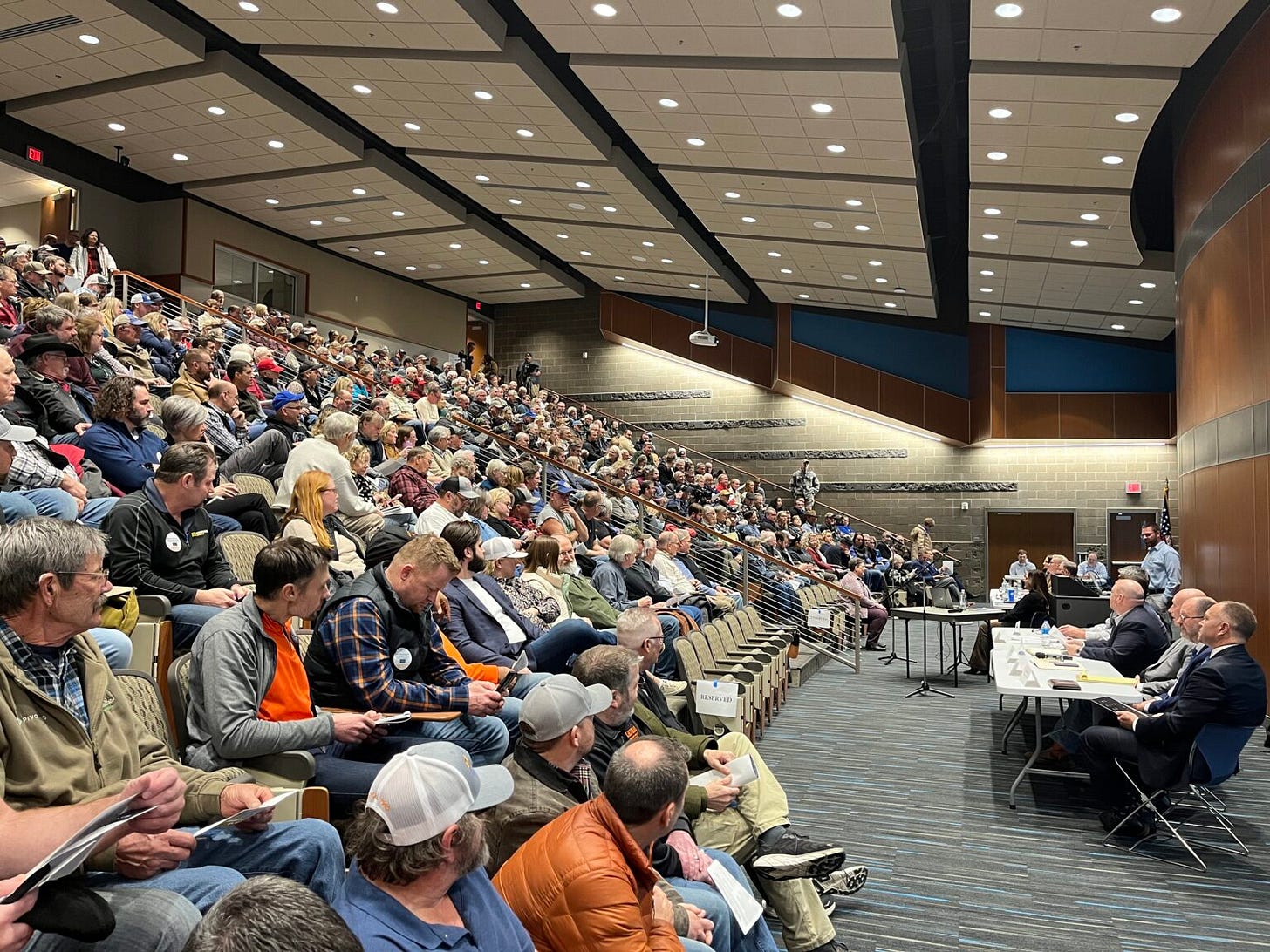 Hundreds of people fill the Southeast Technical College auditorium in Sioux Falls for a Public Utilities Commission hearing about a carbon dioxide pipeline proposal on Jan. 15, 2025. (Makenzie Huber/South Dakota Searchlight)