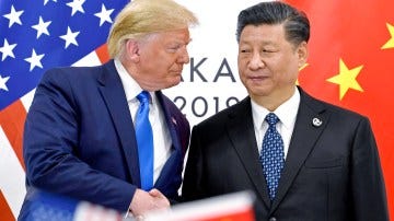 Donald Trump and Xi Jinping shaking hands at a summit.