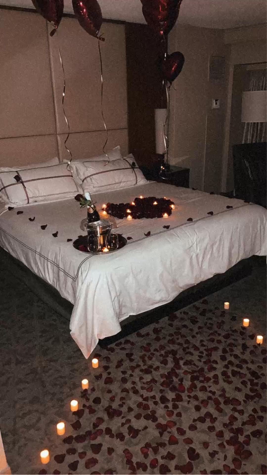 Romantic Hotel Room with Rose Petals and Candles