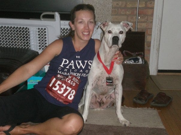 Jacqueline Fisch after Chicago marathon with american bulldog