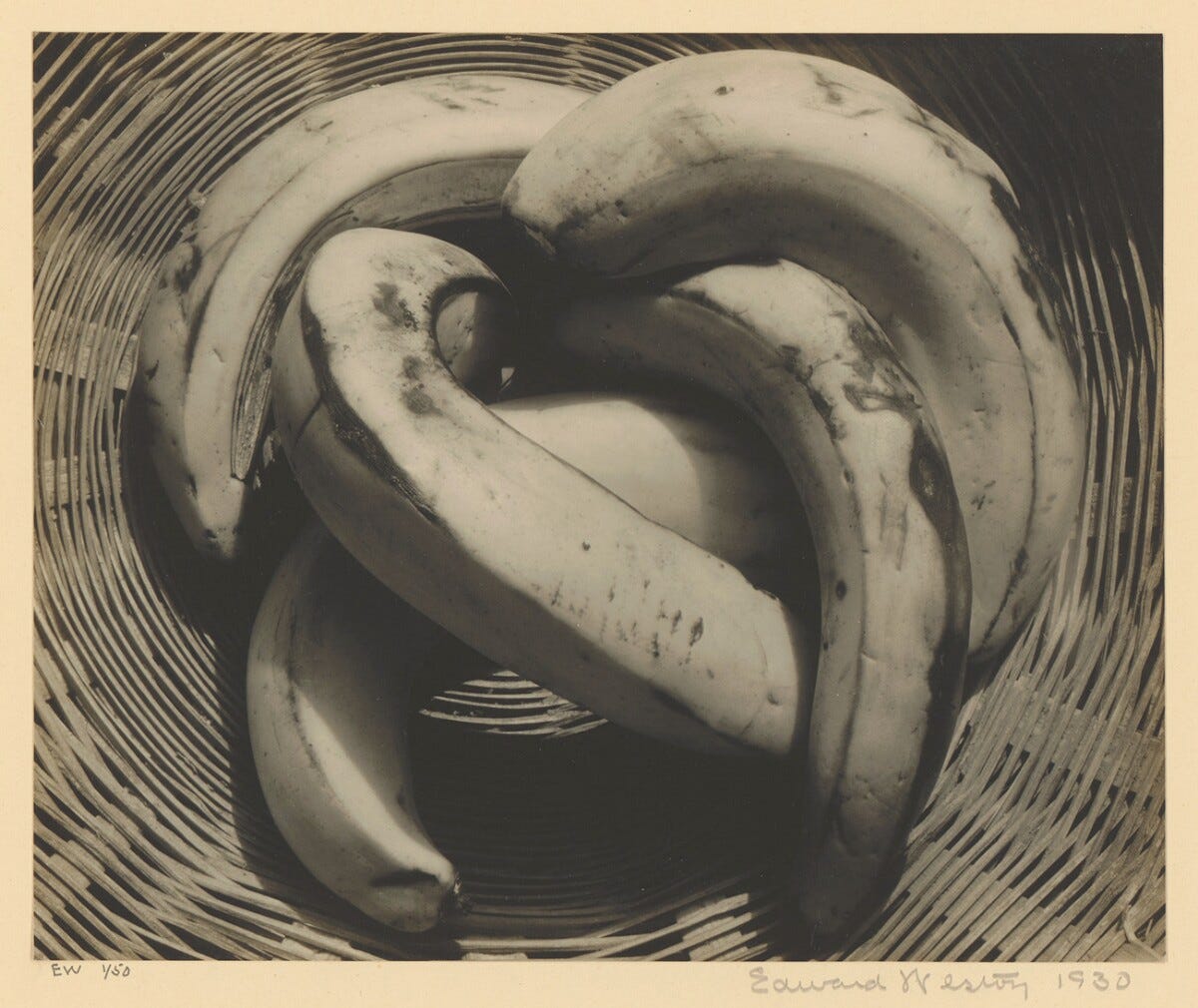 Bananas, Edward Westin. A print of several bananas arranged in a basket, taken from above.