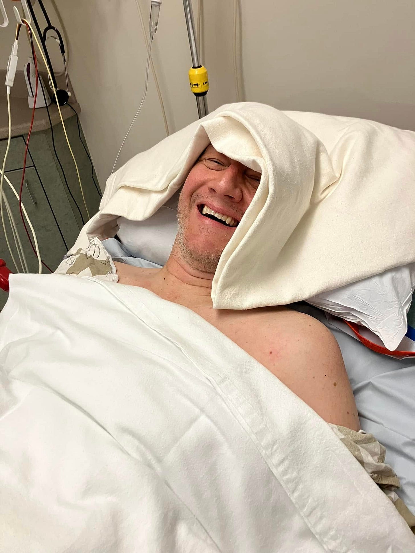 May be an image of 1 person, smiling and hospital