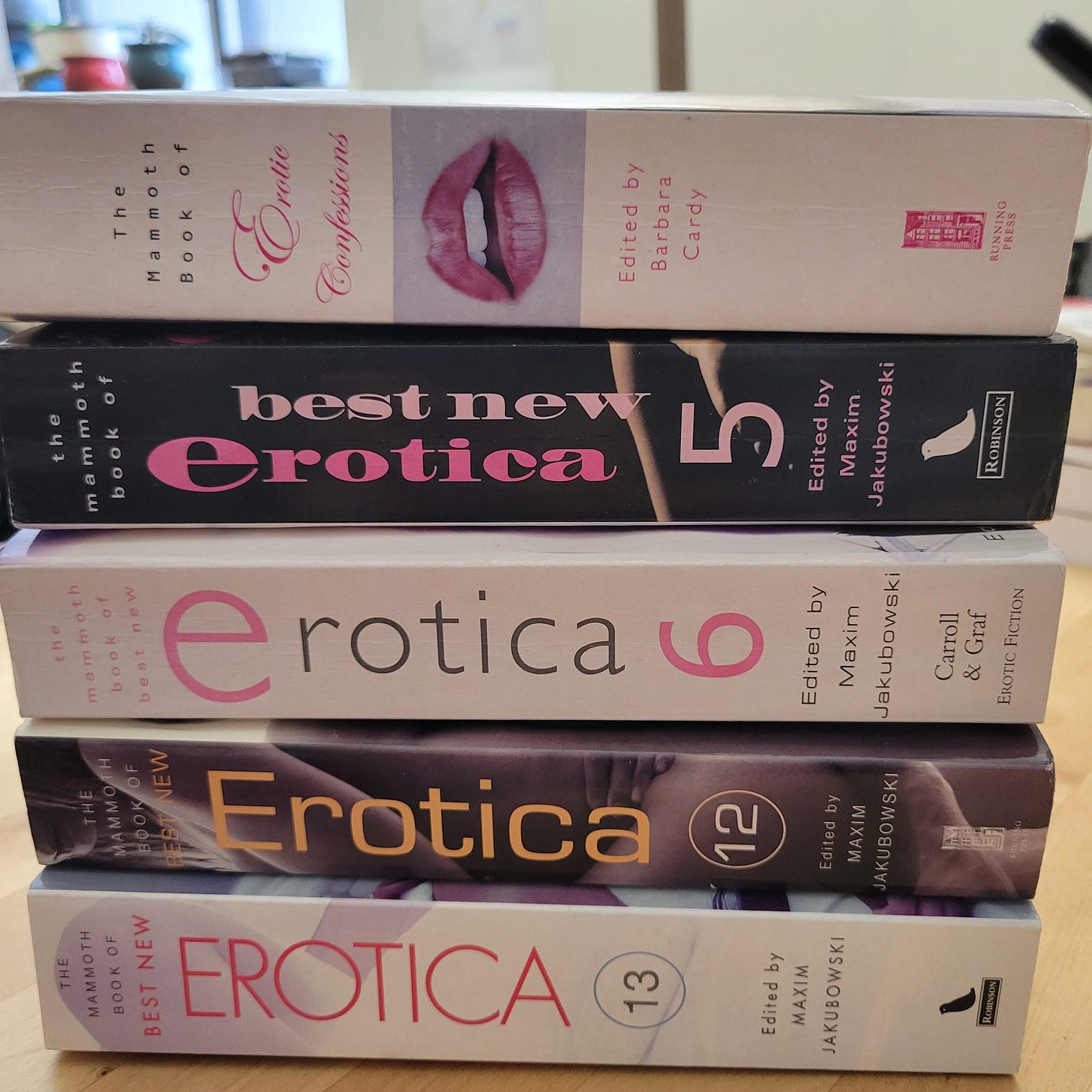 stack of erotic anthologies