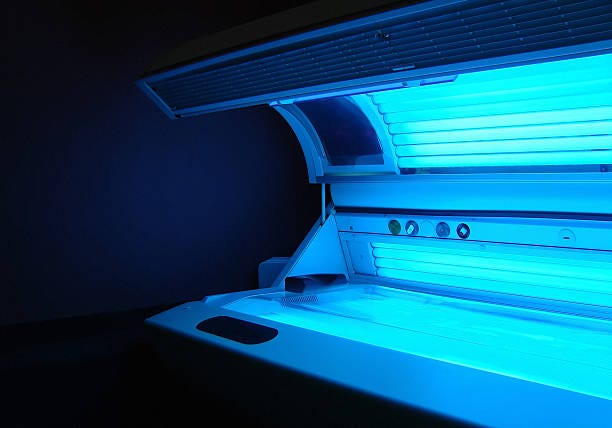 solarium Opened running tanning bed with face tanner... sunbed stock pictures, royalty-free photos & images