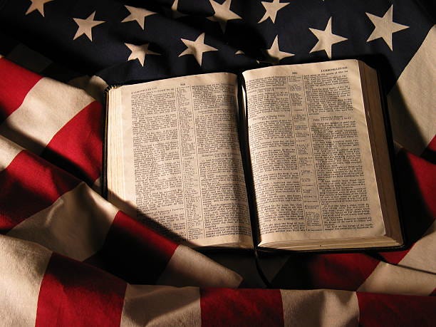 An Opened Bible On Top Of The American Flag Stock Photo - Download Image  Now - Bible, American Flag, Flag - iStock