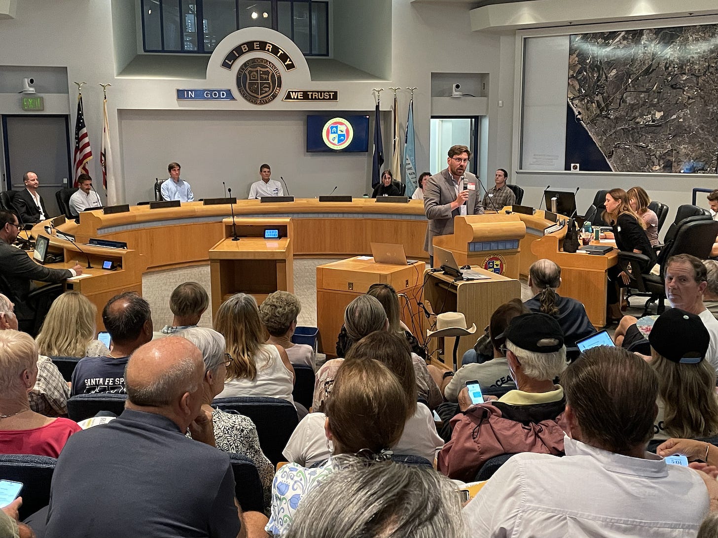 An overflow crowd gathered at the Oceanside City Hall on Tuesday to listen to three presentations from international firms regarding the city’s RE:BEACH replenishment and nourishment pilot program. Steve Puterski photo