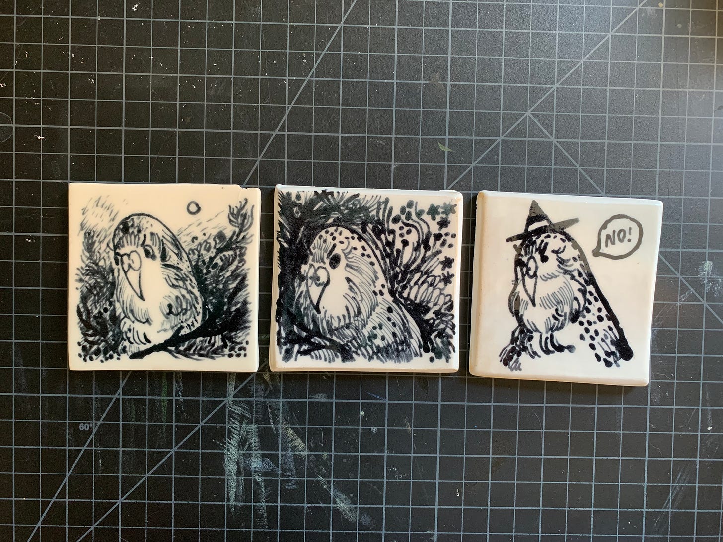 three kakapo drawings on ceramic test tiles with a slip trailer Kayla Stark