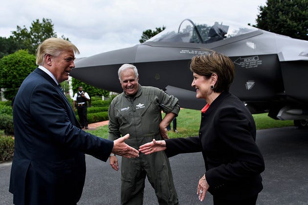 Donald Trump shakes hands with Marillyn Hewson at the White House Donald Trump shakes hands with Marillyn Hewson at the White House