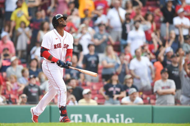 Franchy Cordero of the Boston Red Sox hits a walk off grand slam in the tenth inning against the Seattle Mariners at Fenway Park on May 22, 2022 in...