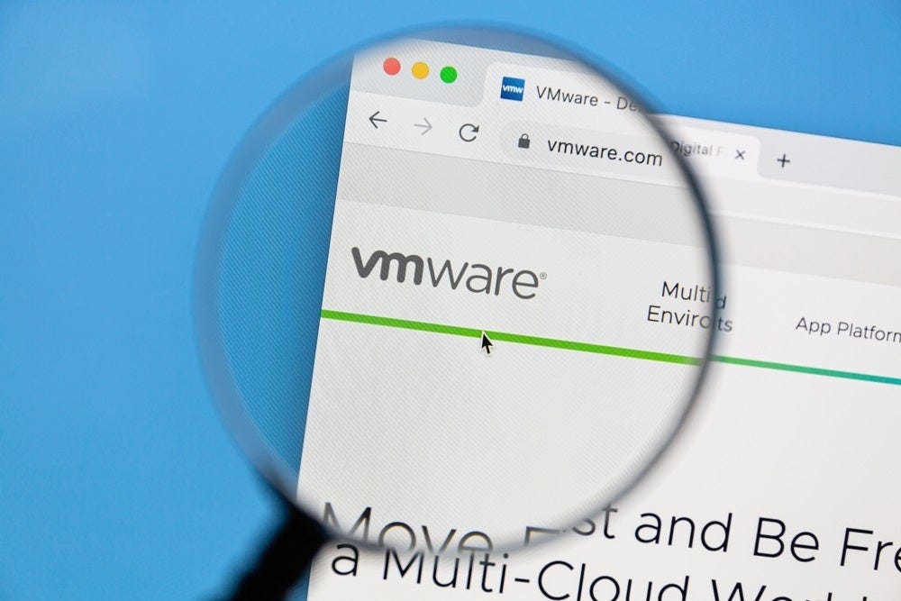 The VMware logo on its website, appearing underneath a looking glass, used to illustrate a story about ESXi.