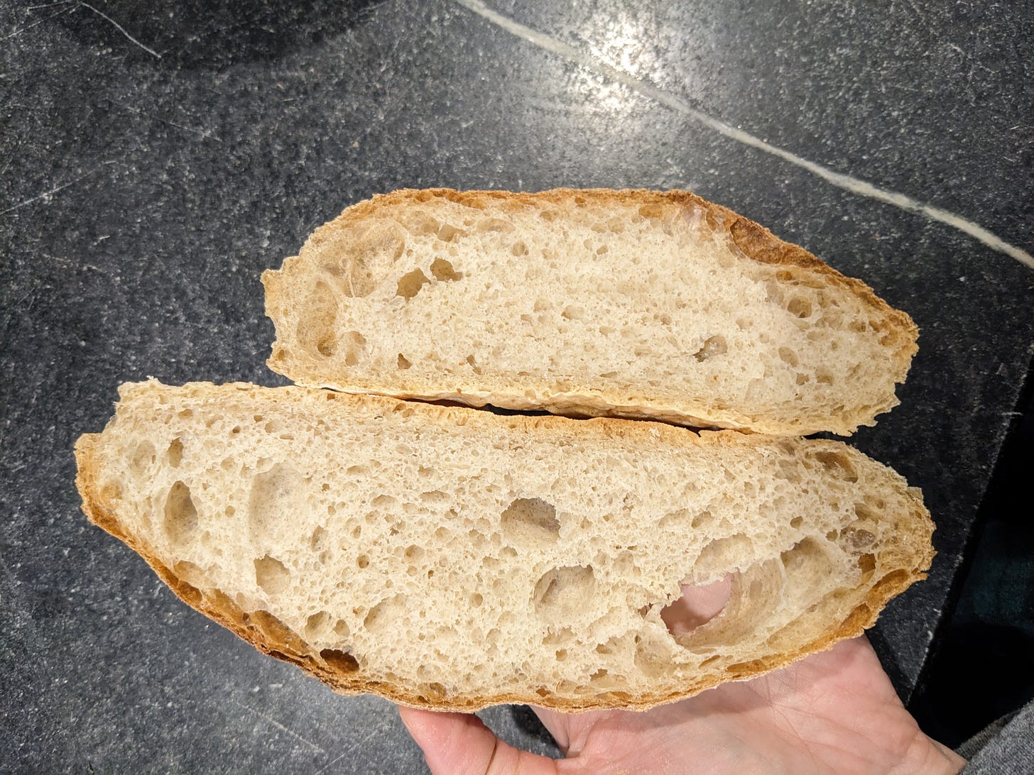 A pair of bread slices on their sides to show the texture.