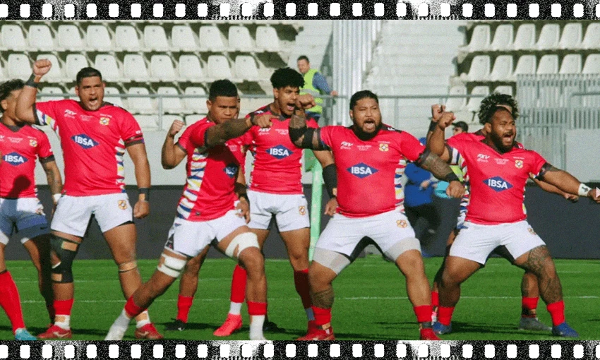 Ikale Tahi performing the sipi tau (warrior dance) on the rugby field. (Image: Archi Banal) 
