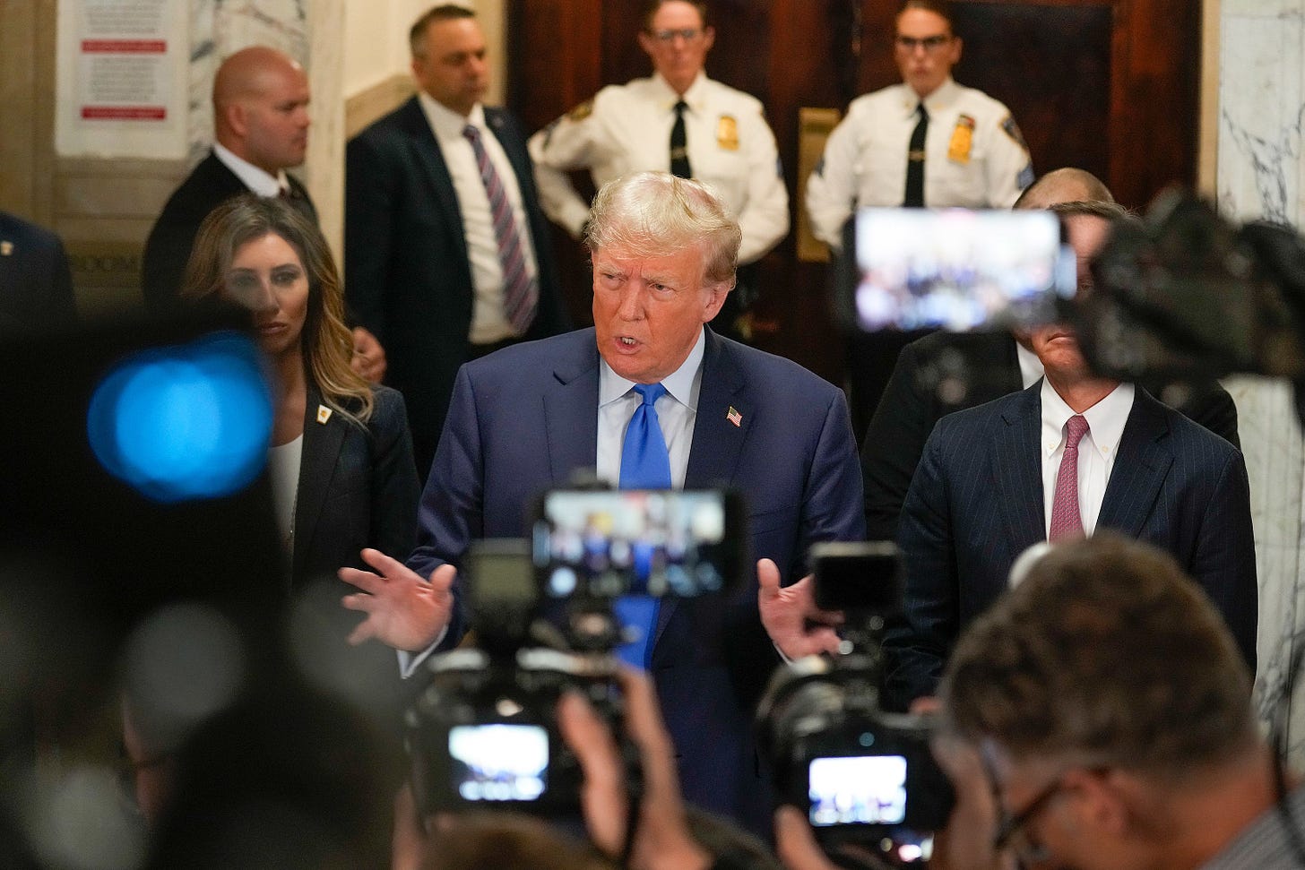 Trump speaks to the media at the New York Supreme Court on October 2. <a href="https://www.cnn.com/politics/live-news/trump-fraud-trial-new-york-10-02-23/h_e83e2797310240ba7e8540e4c80ba014" target="_blank">On his way to the courtroom</a>, Trump said the civil fraud trial is a "continuation of the single greatest witch hunt of all time." He also called it "a scam and a sham."