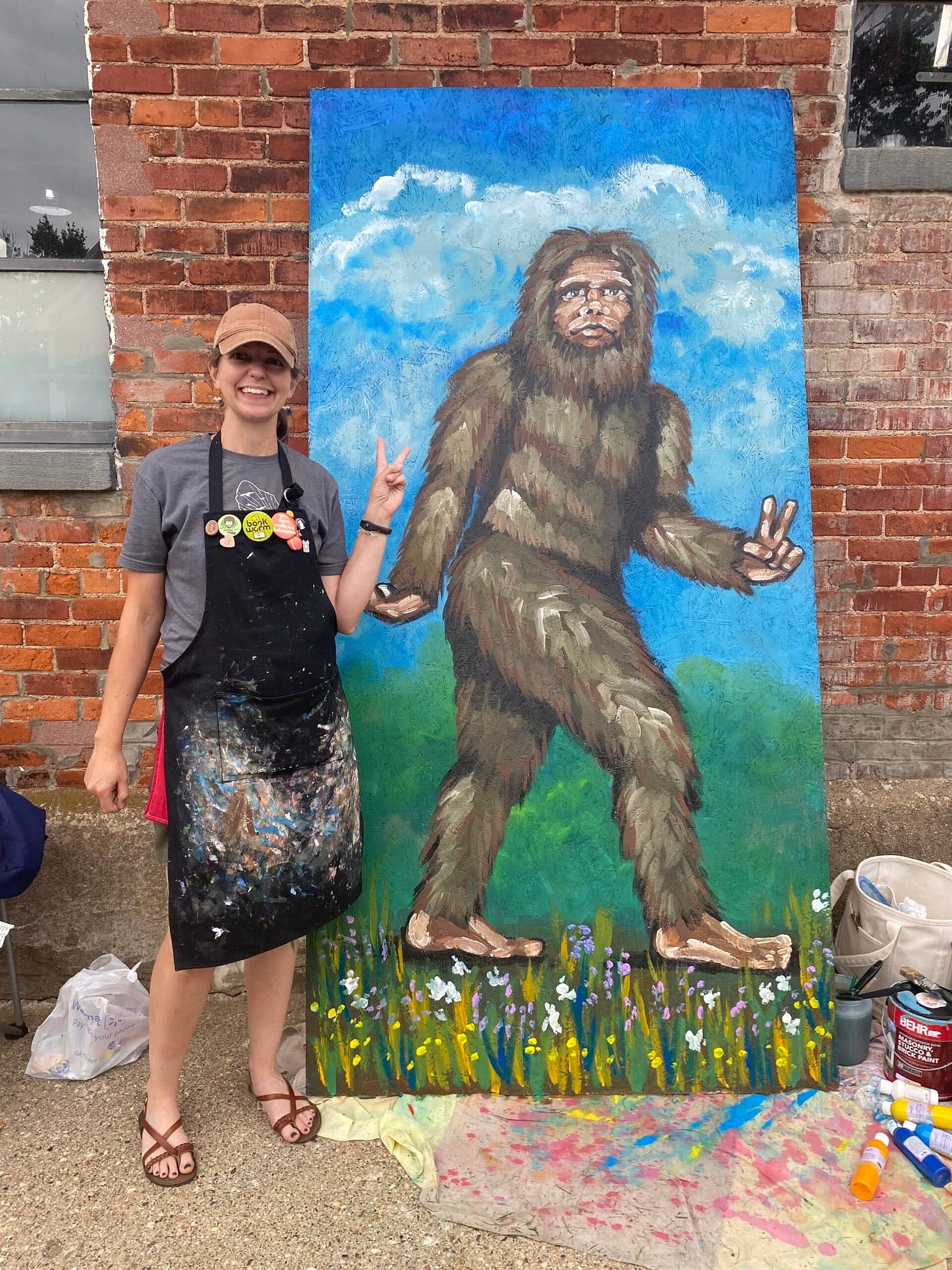 Amy Lou Gieschen with her life-sized Bigfoot painting.