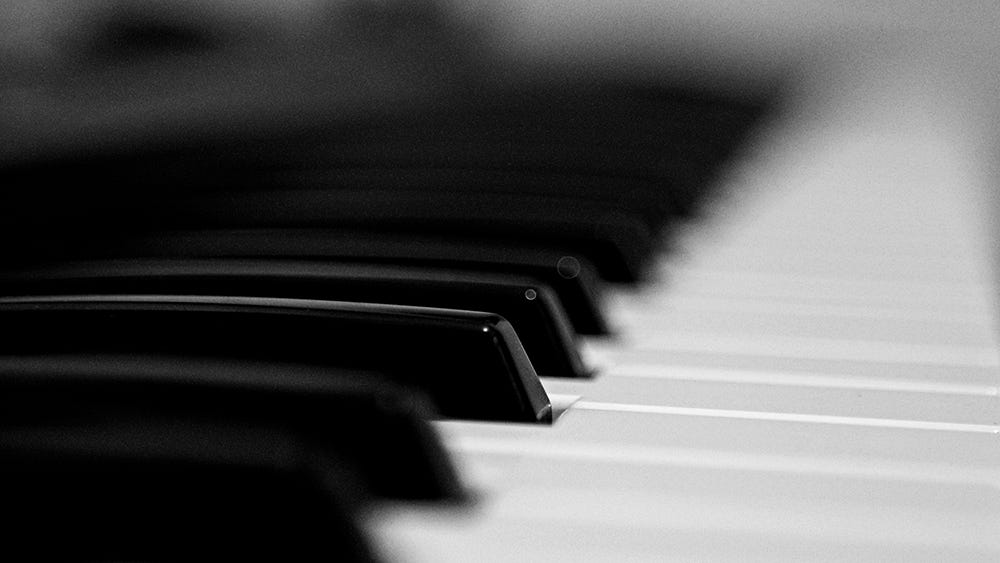 A close-up black-and-white photo of piano keys