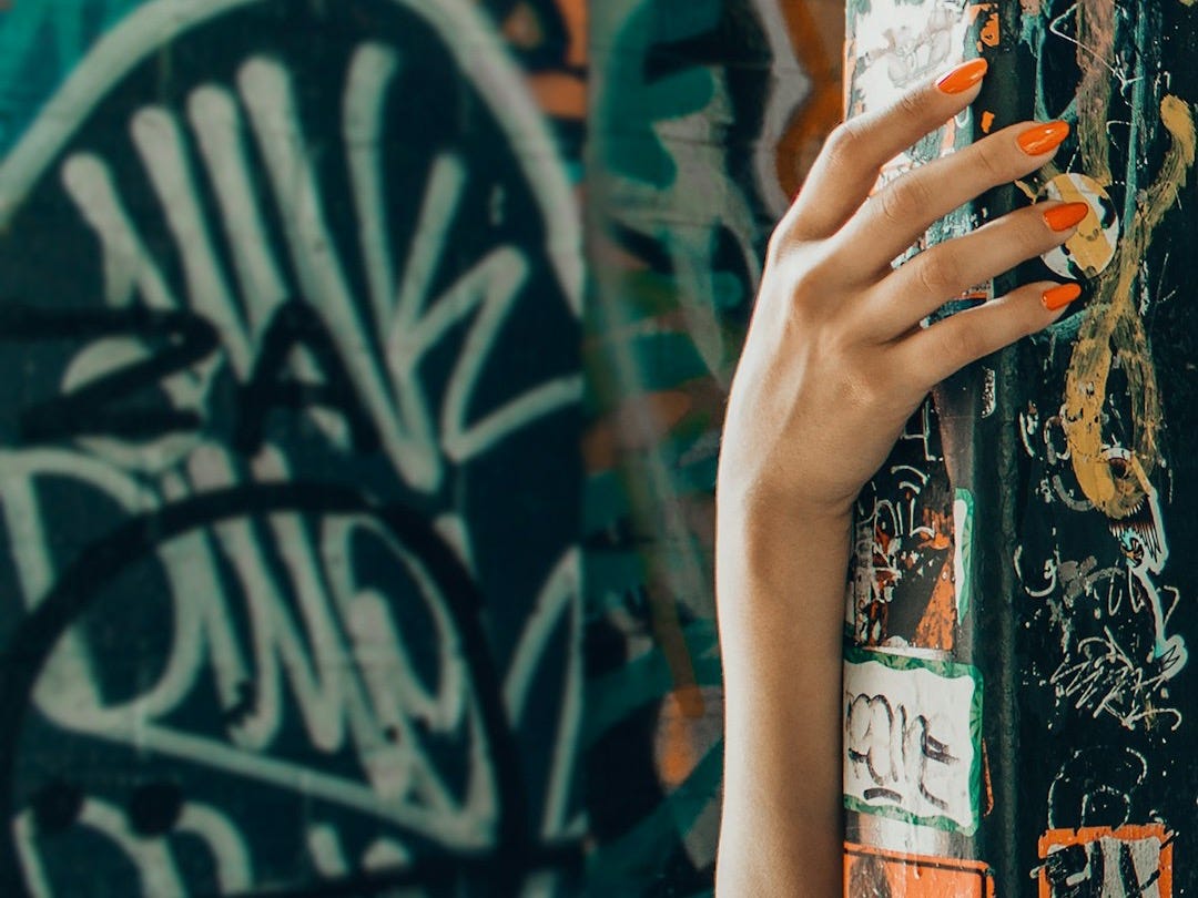 orange and multicolored graffiti wall art