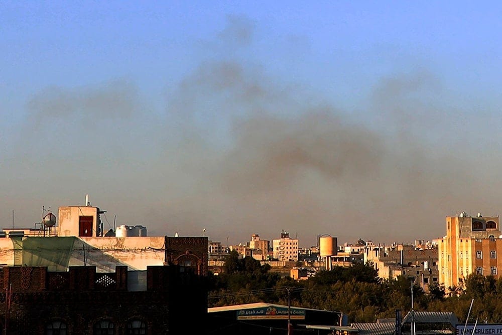 Smoke rises from the area around the International Airport following an airstrike, as seen from Sanaa, Yemen, Thursday, Dec. 26, 2024. (AP)