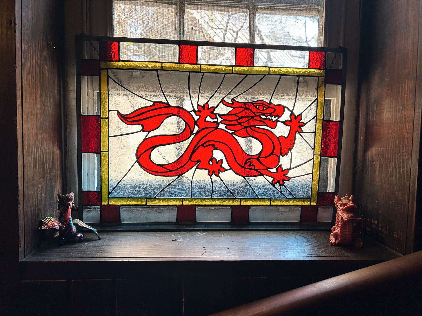 Stained glass window of red dragon from Wheel of Time