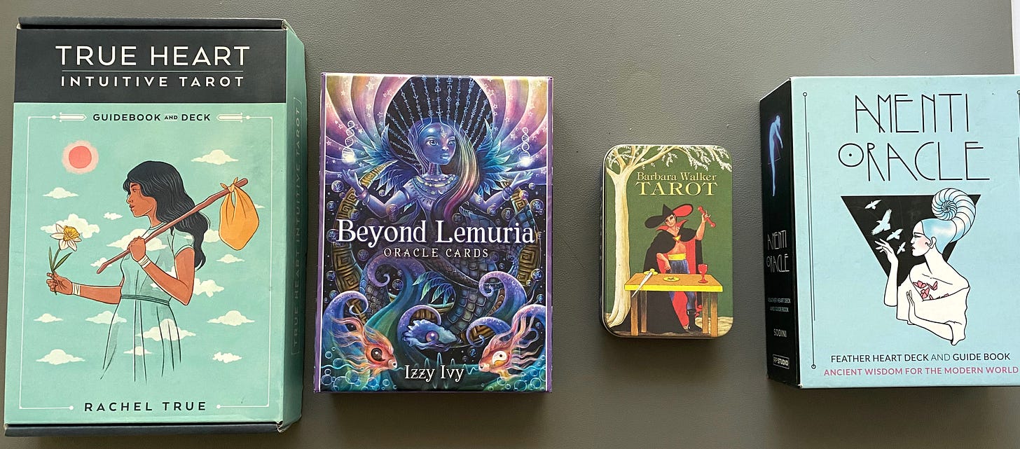 2 tarot decks: True Hart Tarot by Rachel True, and Tarot by Barbara Walker; and two oracle deks: Beyond Lemuria by Izzy Ivy and Amenti Oracle