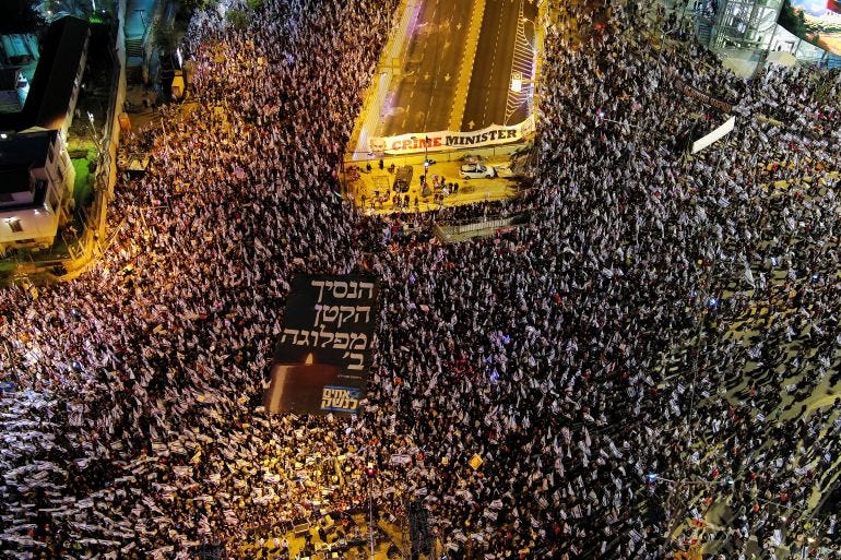 Protestors take part in a demonstration against Israeli Prime Minister Benjamin Netanyahu