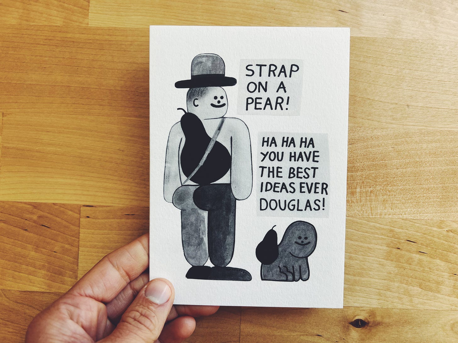 Card that has a man with a pear strapped to his back that says "strap on a pear" and a dog with a pear on its back too saying "you have great ideas Douglas"