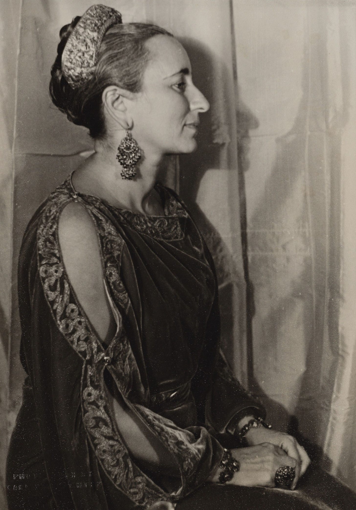 profile portrait of Bernardine dressed sumptuously, almost like a queen