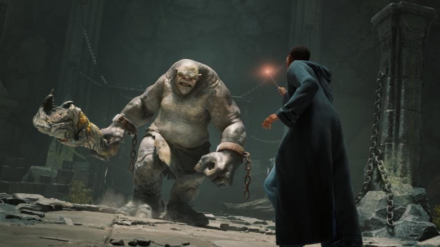 A wizard fighting a troll in Hogwarts Legacy