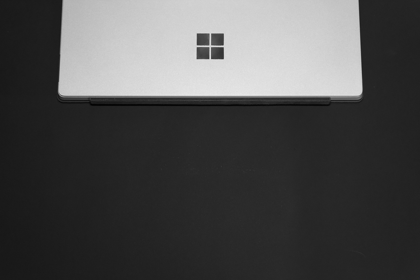 A laptop showing the Windows logo. (Ashkan Forouzani / Unsplash)