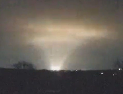 Nighttime view of a bright light in the sky.
