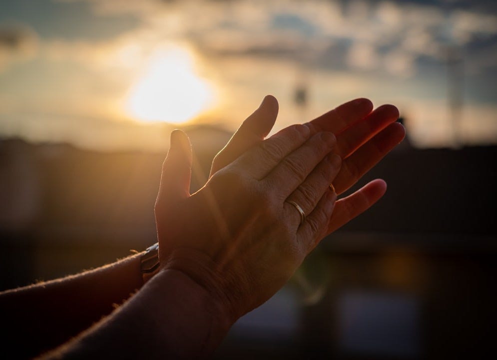 persons left hand with silver ring persons left hand with silver ring
