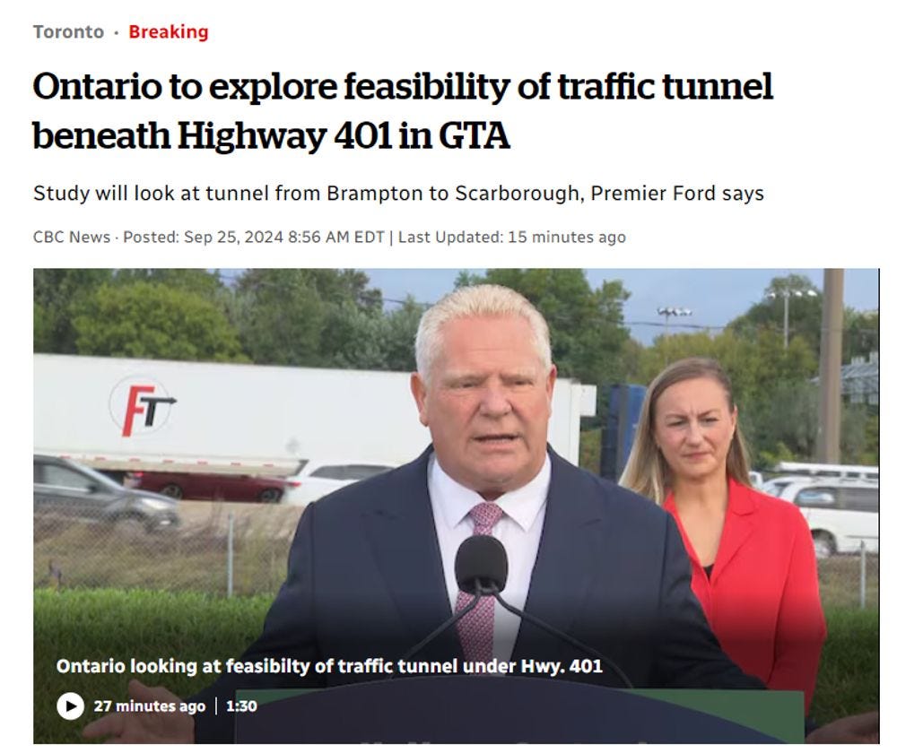 Toronto·Breaking
Ontario to explore feasibility of traffic tunnel beneath Highway 401 in GTA
Study will look at tunnel from Brampton to Scarborough, Premier Ford says
CBC News · Posted: Sep 25, 2024 8:56 AM EDT |

Doug Ford, in a dark suit, stands with minister Kinga Surma, dressed in scarlet, hovering close behind him.