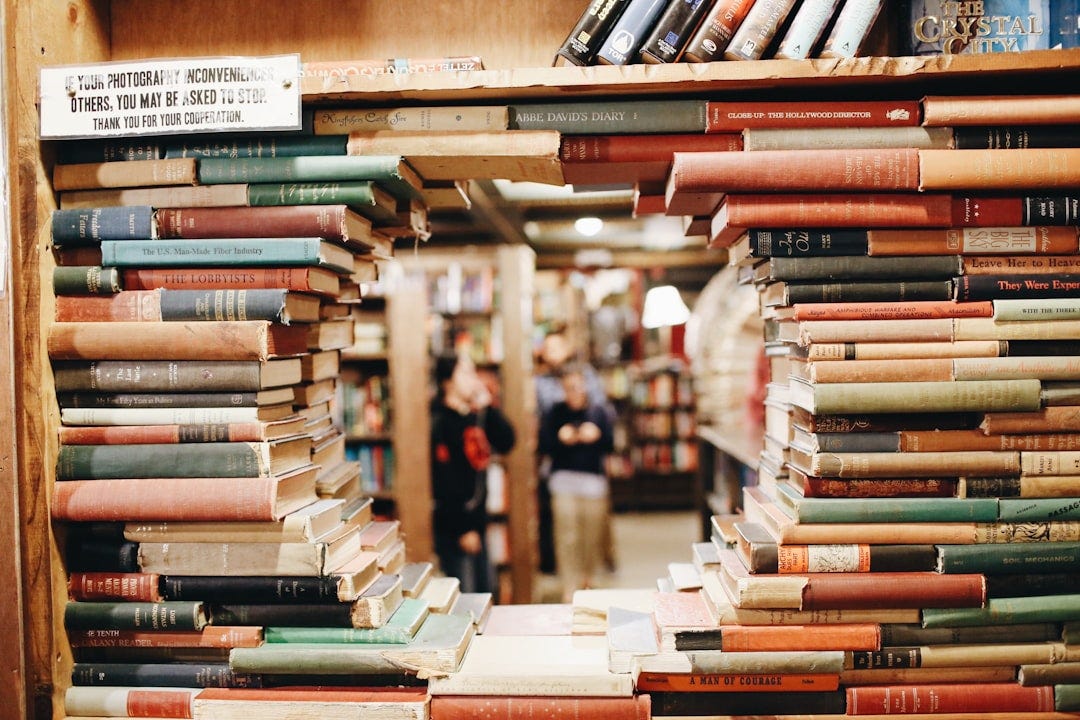 books on brown wooden shelf