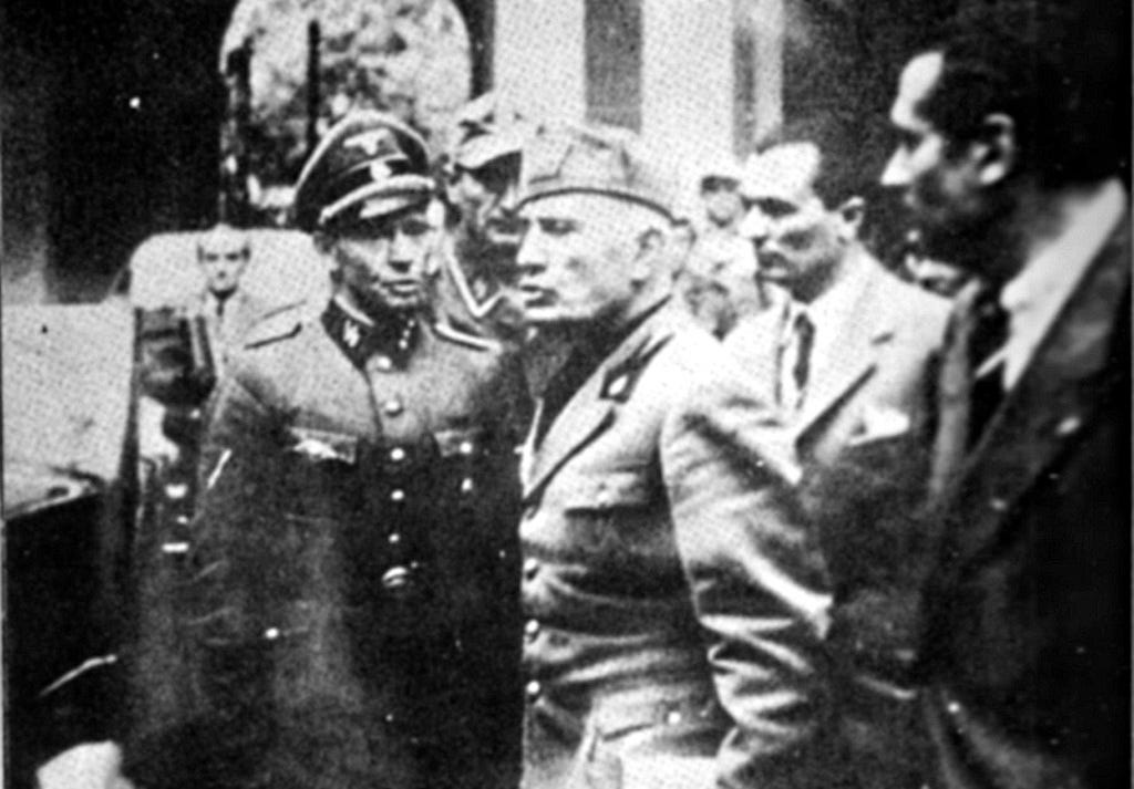 Last photo before Mussolini death, dated 25 April 1945. Here he is abandoning the Prefecture in Milan.