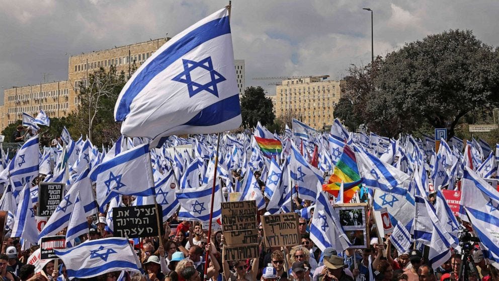 An anti judicial reform protest in Jerusalem featuring a sea of Israeli flags